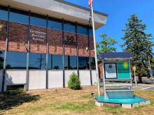 The Solstreet solar-powered bench outside the Easthampton Municipal Building has room for municipal announcements. STAFF PHOTO/MICHAEL CONNORS